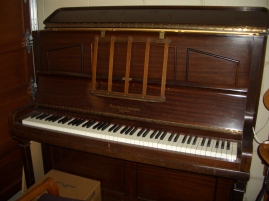 'Nana's' piano. Actually ours, with the theme tune played honky tonk style by my partner Tim (because the piano was in the garage back then!)