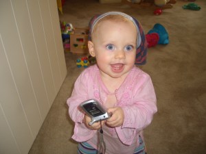Kaya employs tactile and visual learning here - wearing her brother's undies on her head and mum's old phone safe in hand!